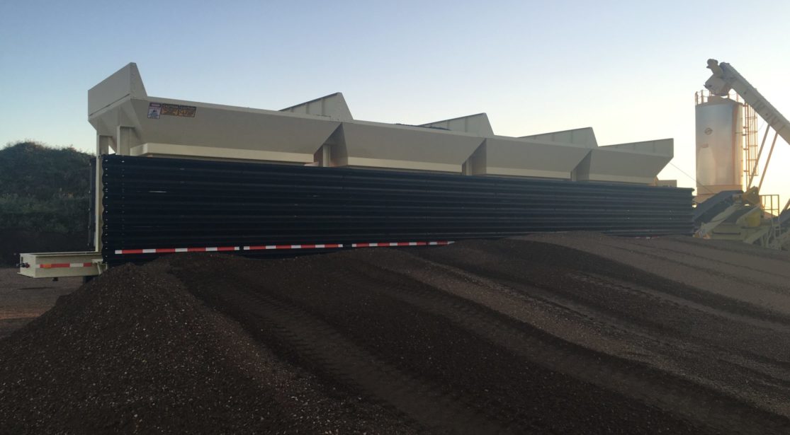 Aesco Madsen 4 bin cold feed system with optional backfill bulkhead ready for transport.